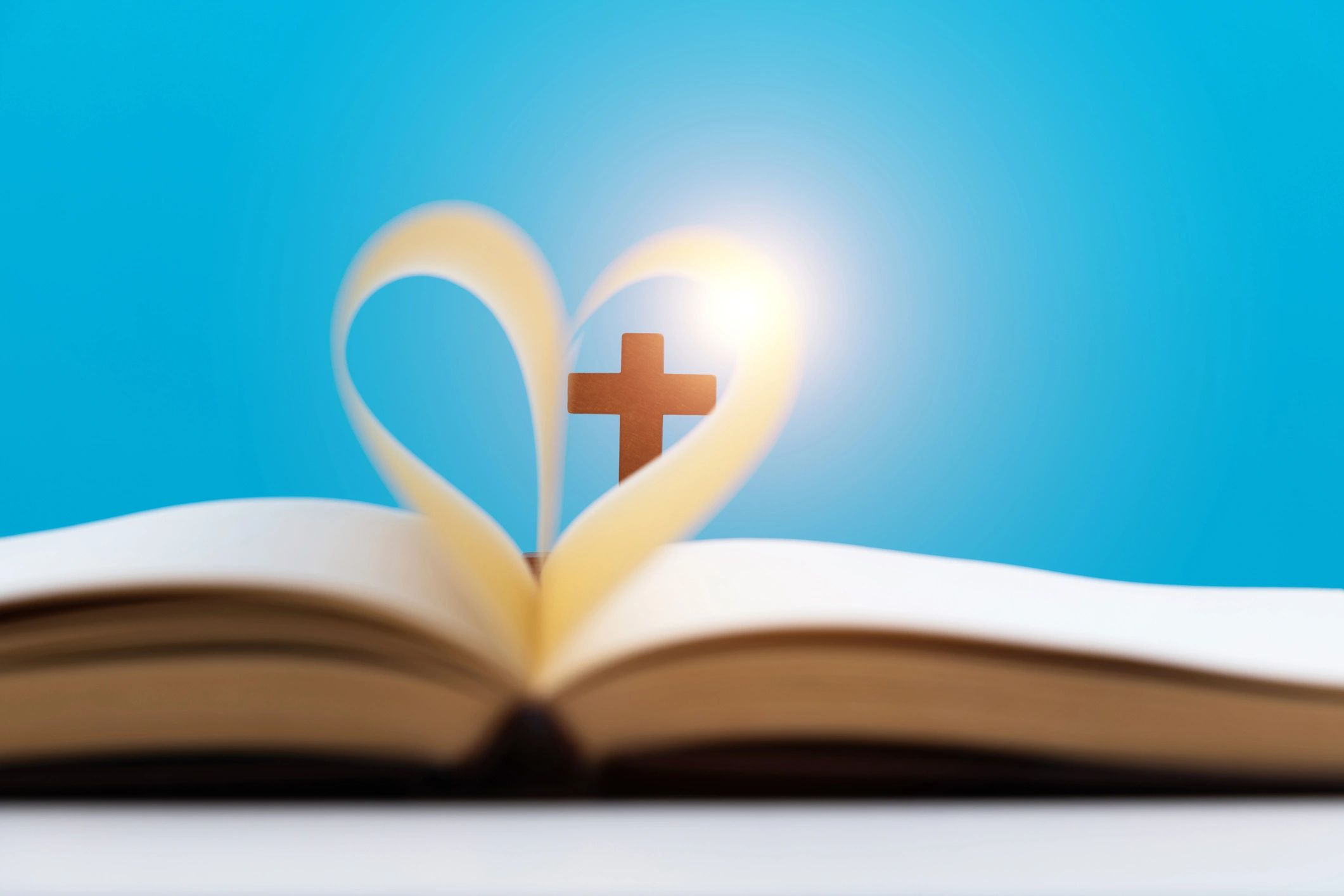 Heart shape made from book pages symbolizing love for Scripture